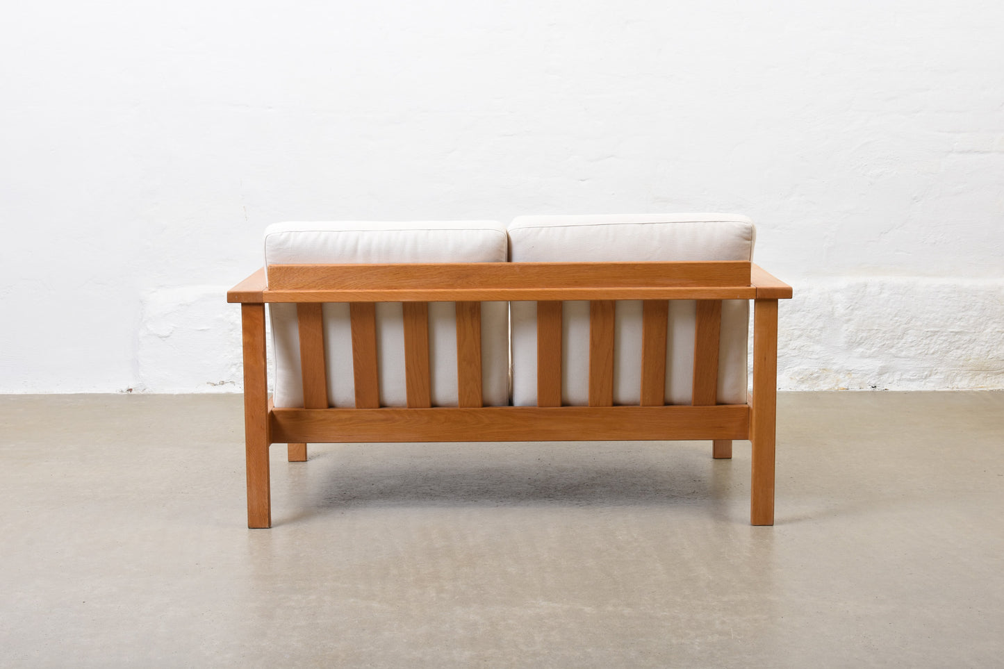 Newly reupholstered: 1960s oak + canvas two seater