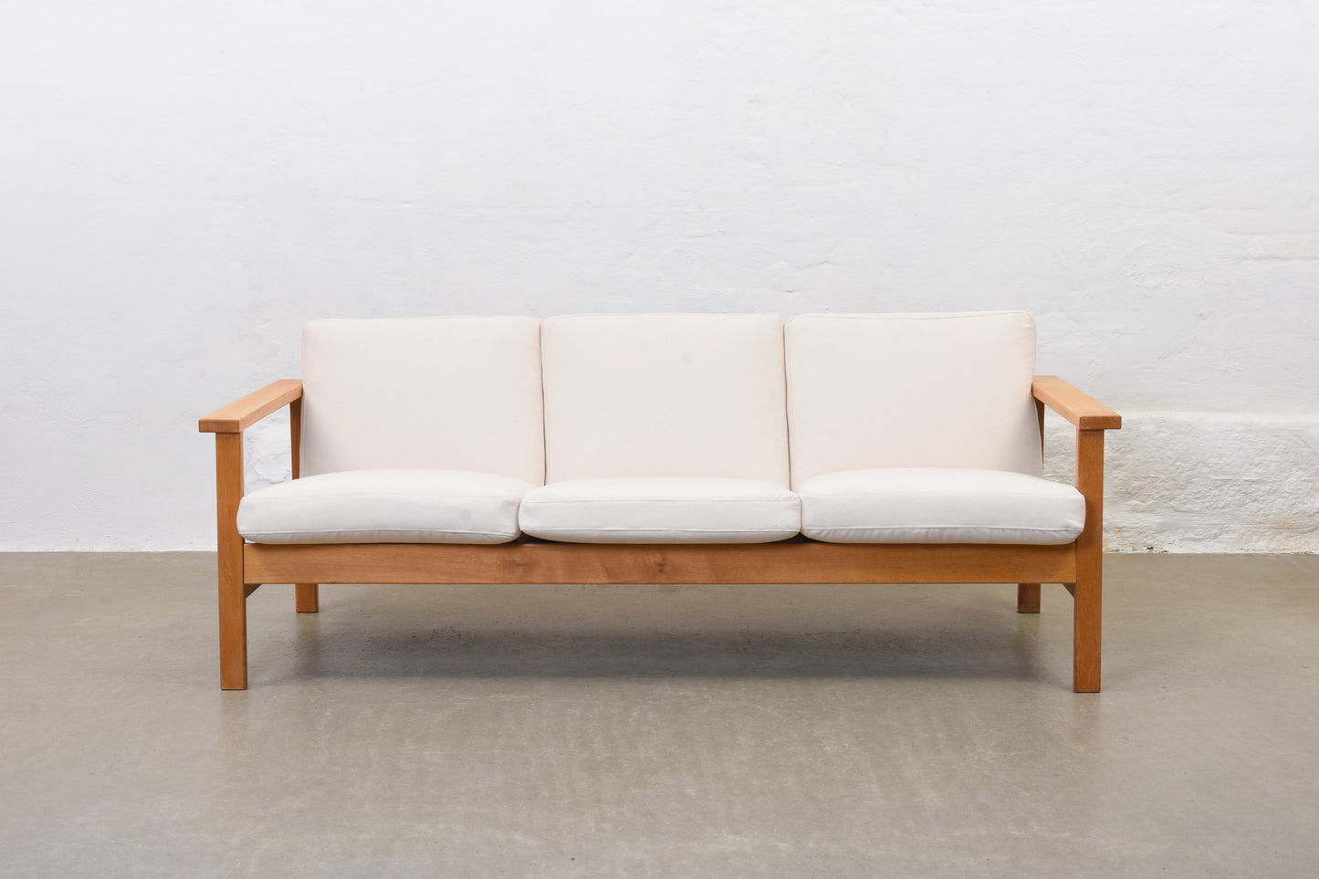 Newly reupholstered: 1960s oak + canvas three seater