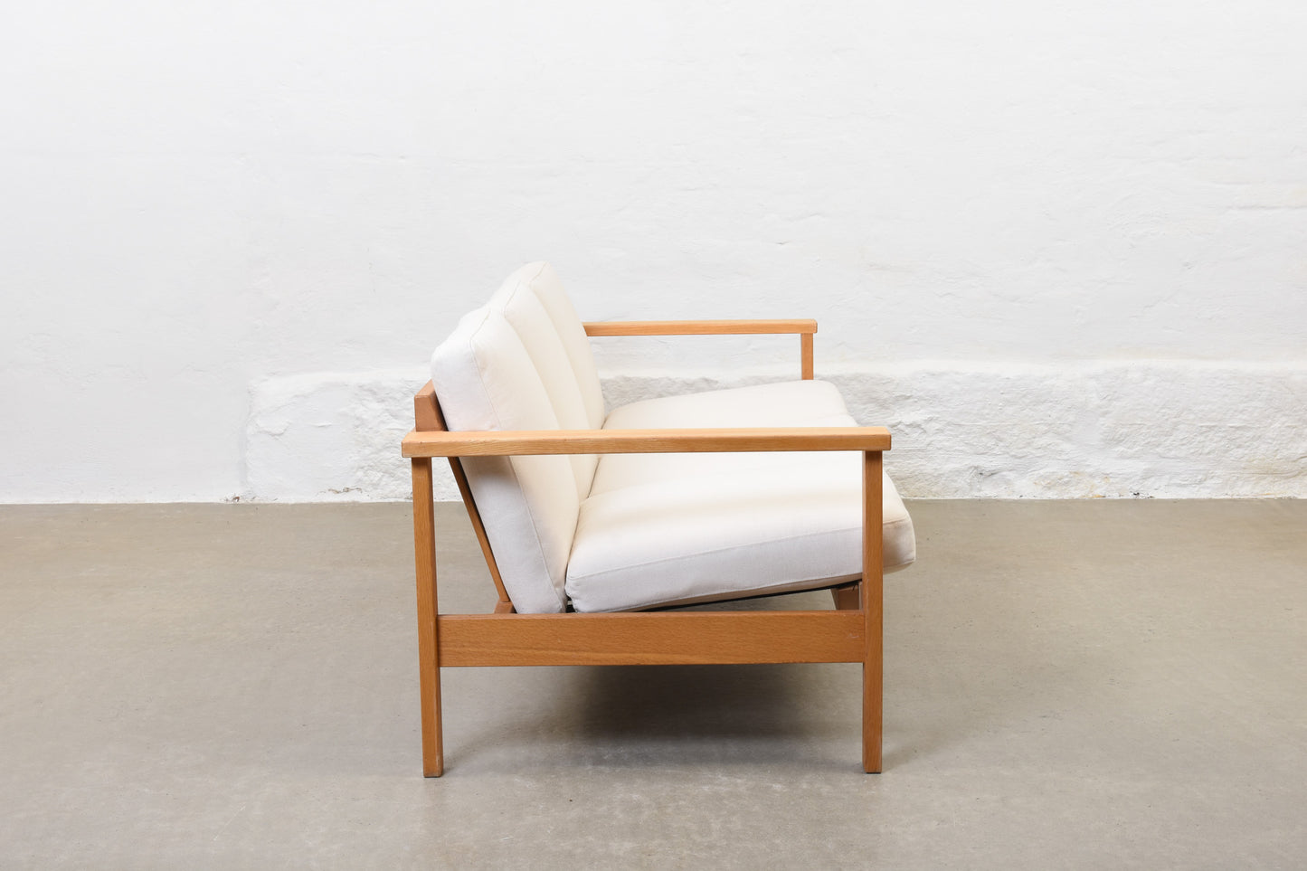 Newly reupholstered: 1960s oak + canvas three seater