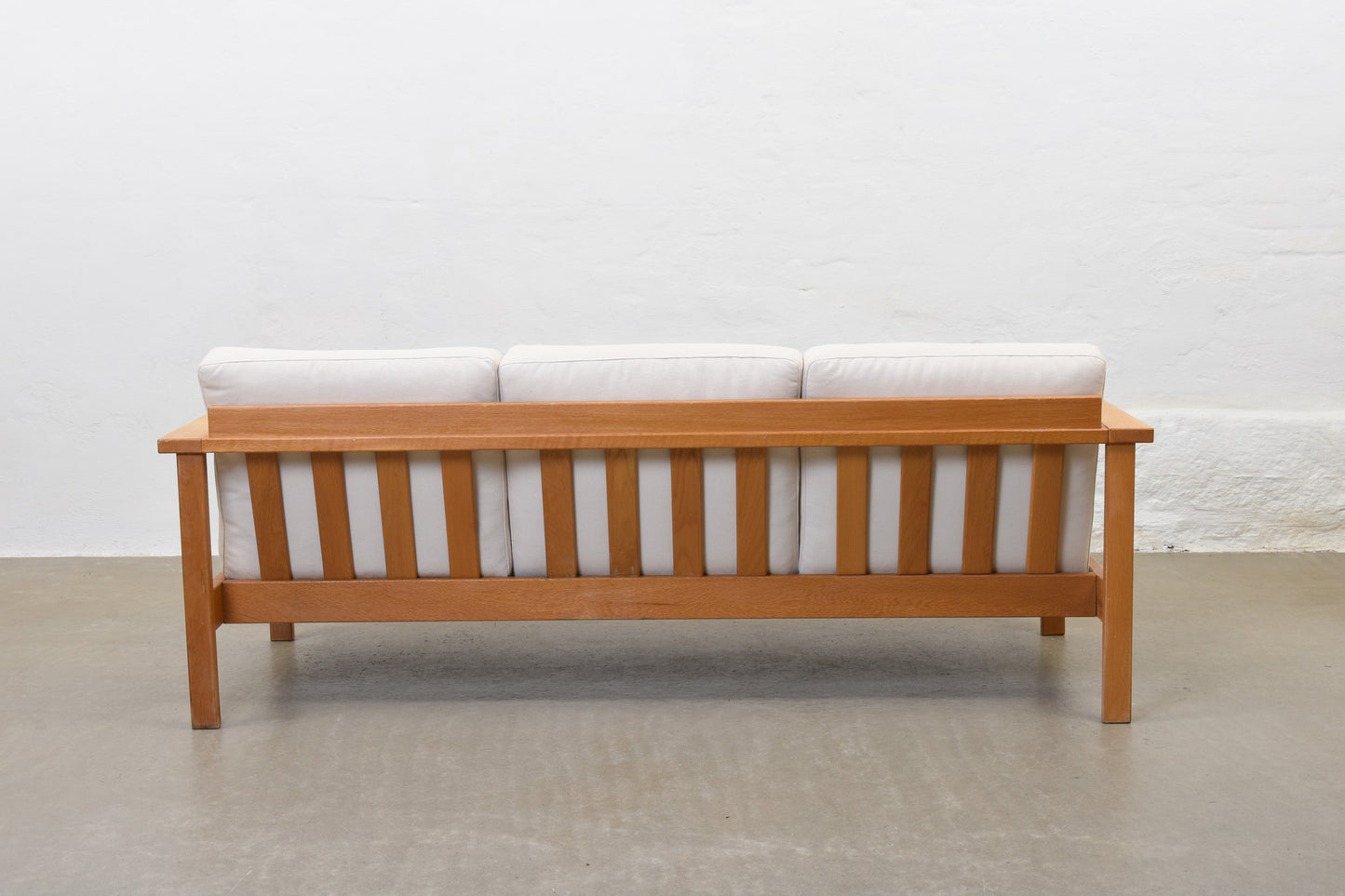 Newly reupholstered: 1960s oak + canvas three seater