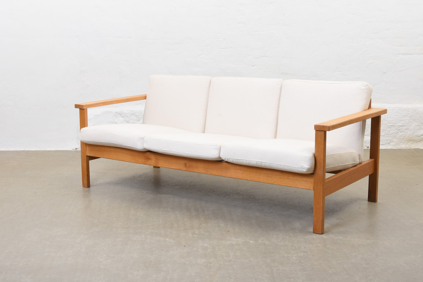Newly reupholstered: 1960s oak + canvas three seater