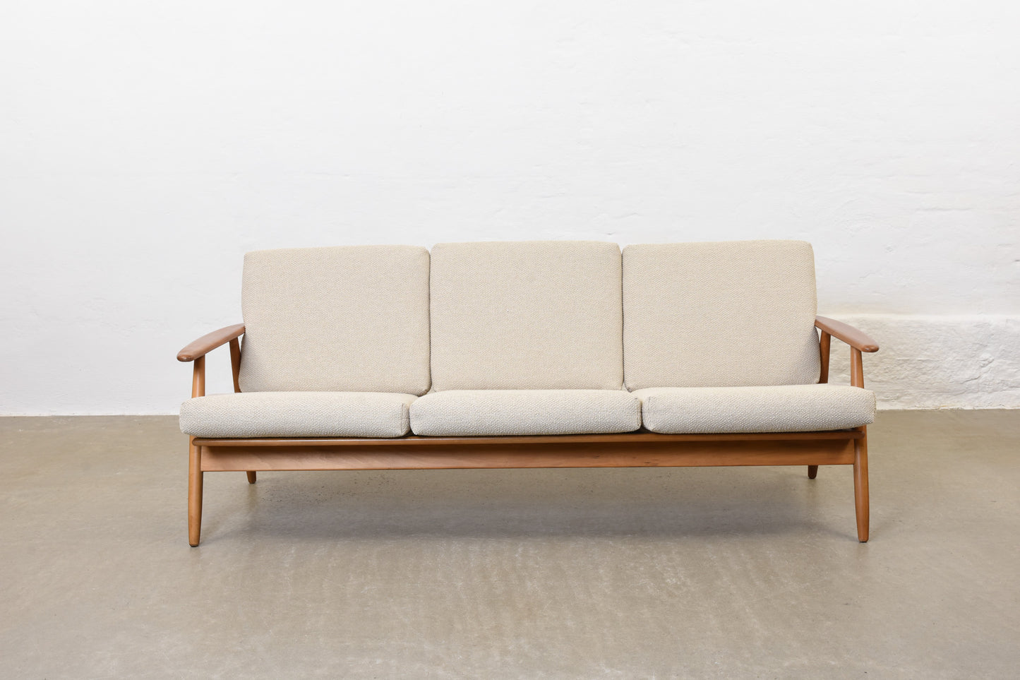 Newly reupholstered: 1960s three seat sofa in beech