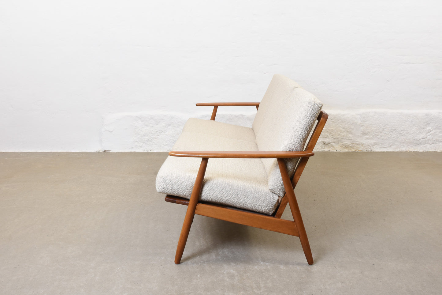 Newly reupholstered: 1960s three seat sofa in beech