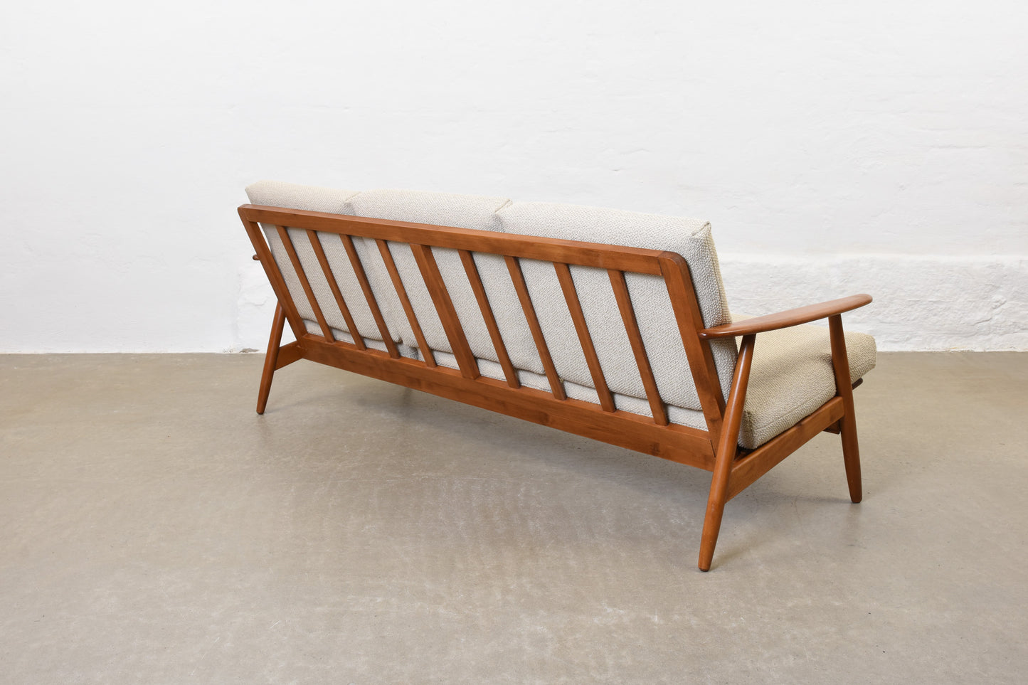 Newly reupholstered: 1960s three seat sofa in beech