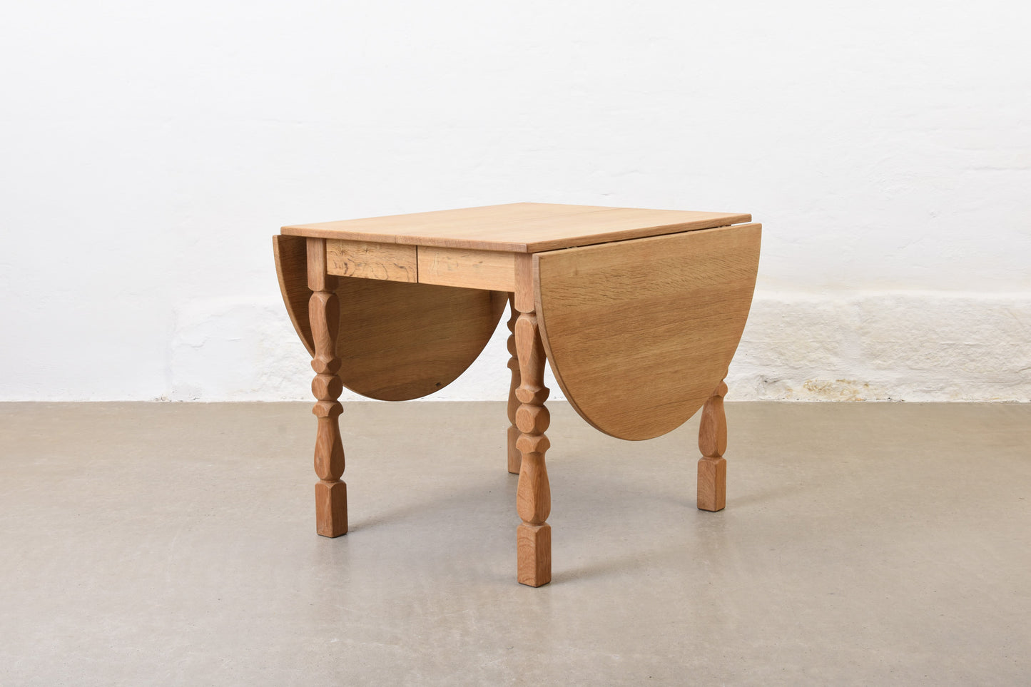 1960s drop leaf dining table in oak by Henning Kjærnulf