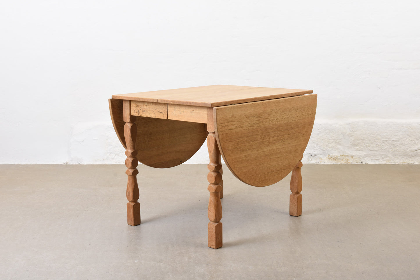 1960s drop leaf dining table in oak by Henning Kjærnulf