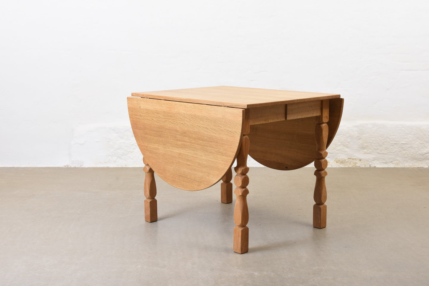 1960s drop leaf dining table in oak by Henning Kjærnulf