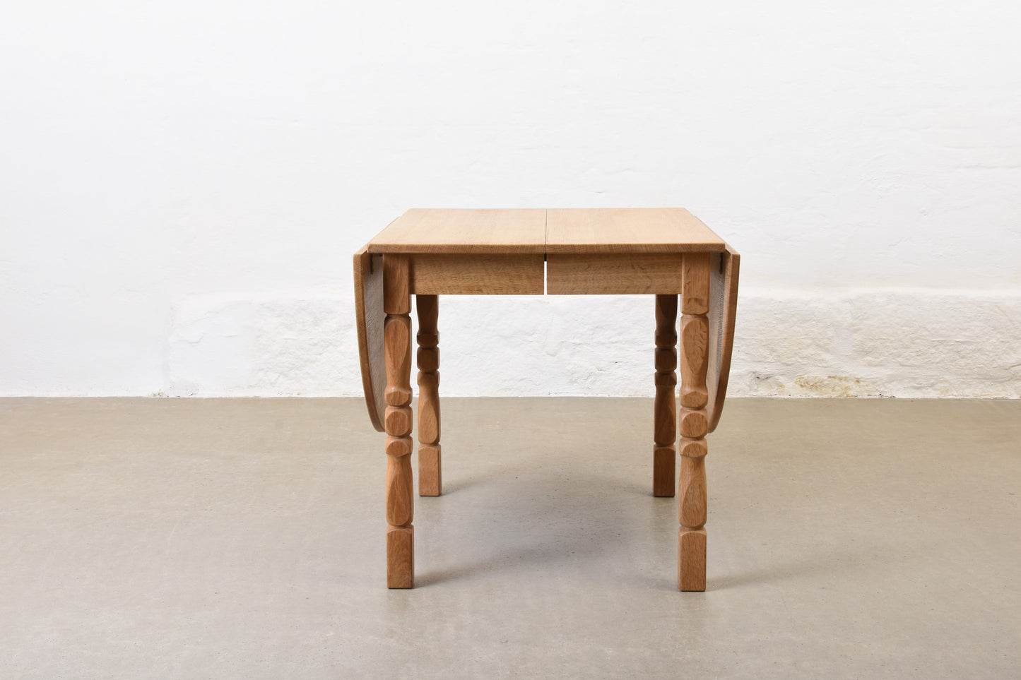 1960s drop leaf dining table in oak by Henning Kjærnulf