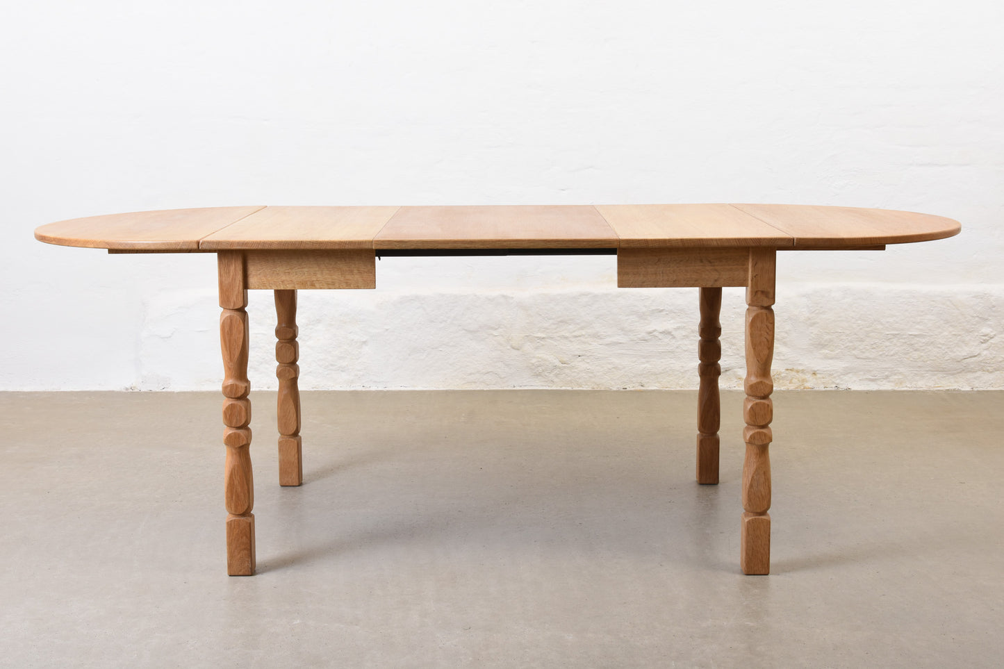 1960s drop leaf dining table in oak by Henning Kjærnulf