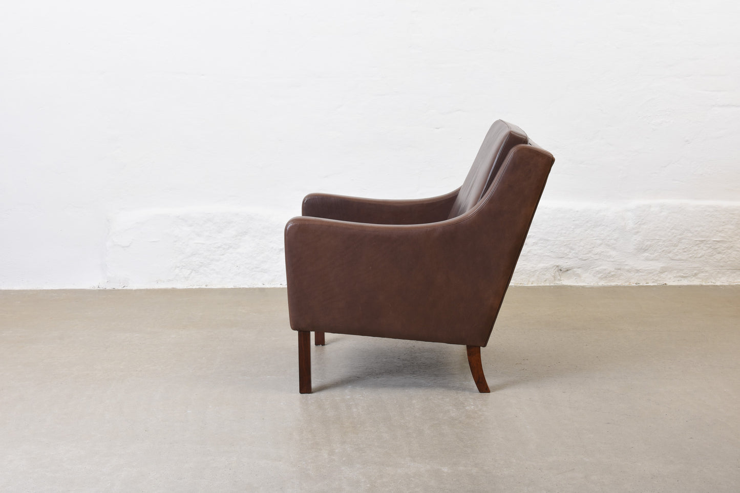 20% off: 1960s leather club chair on rosewood legs