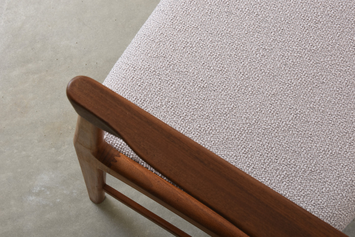 Newly upholstered: 1950s teak armchair