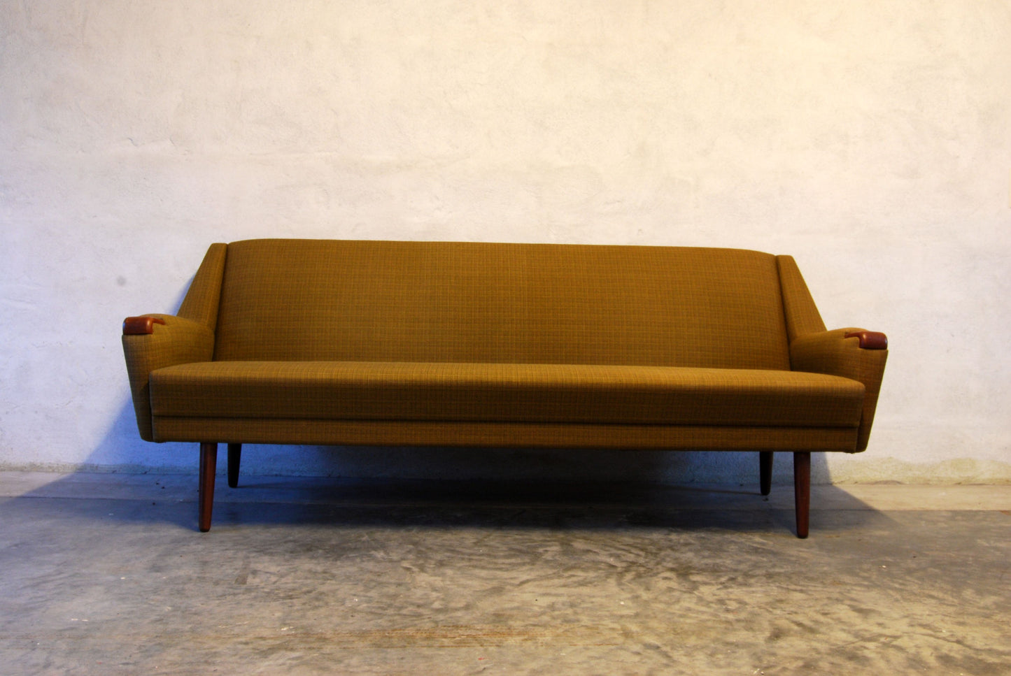Three seat sofa with teak paws