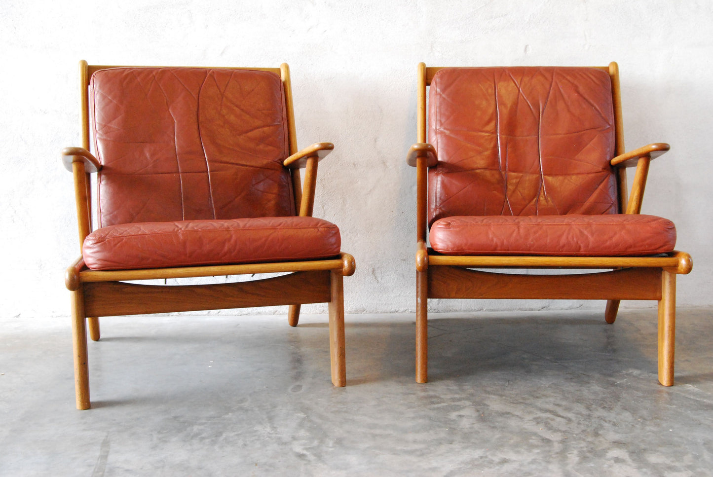 Pair of oak lounge chairs by Poul Volther