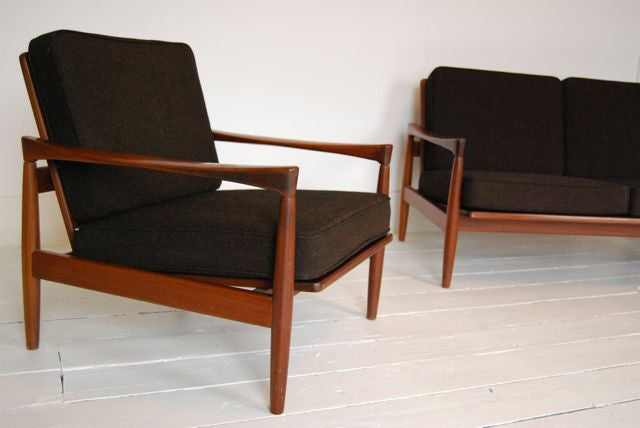 Teak-framed three seat sofa