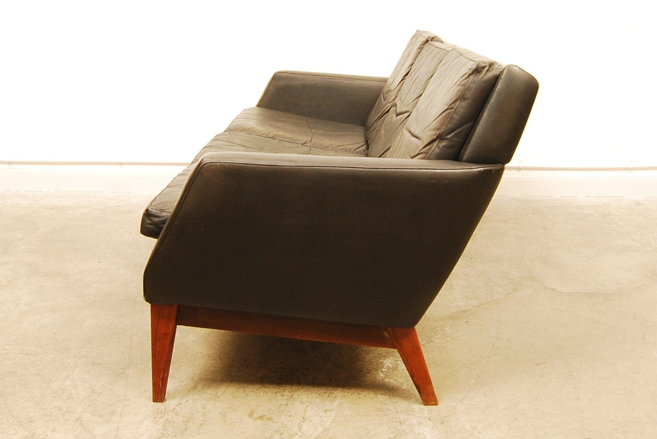 Three seat black leather sofa. Denmark, 1960s