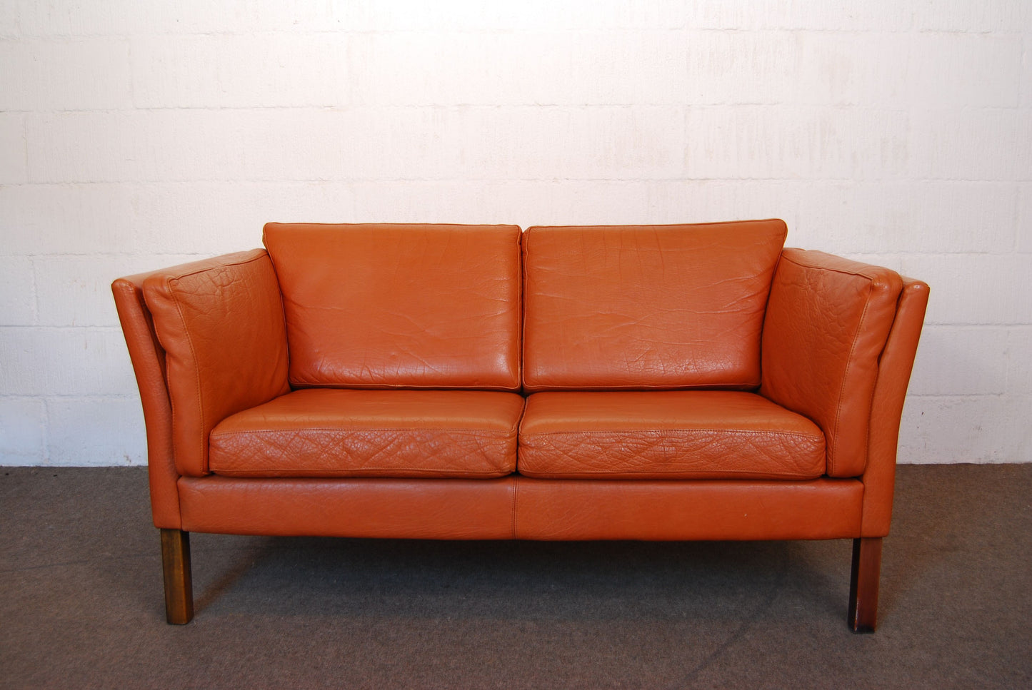 Two seat leather sofa by Mogens Hansen