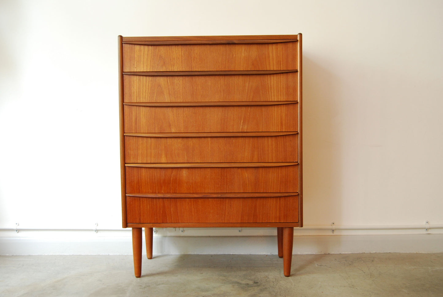 Teak chest of drawers with lipped handles