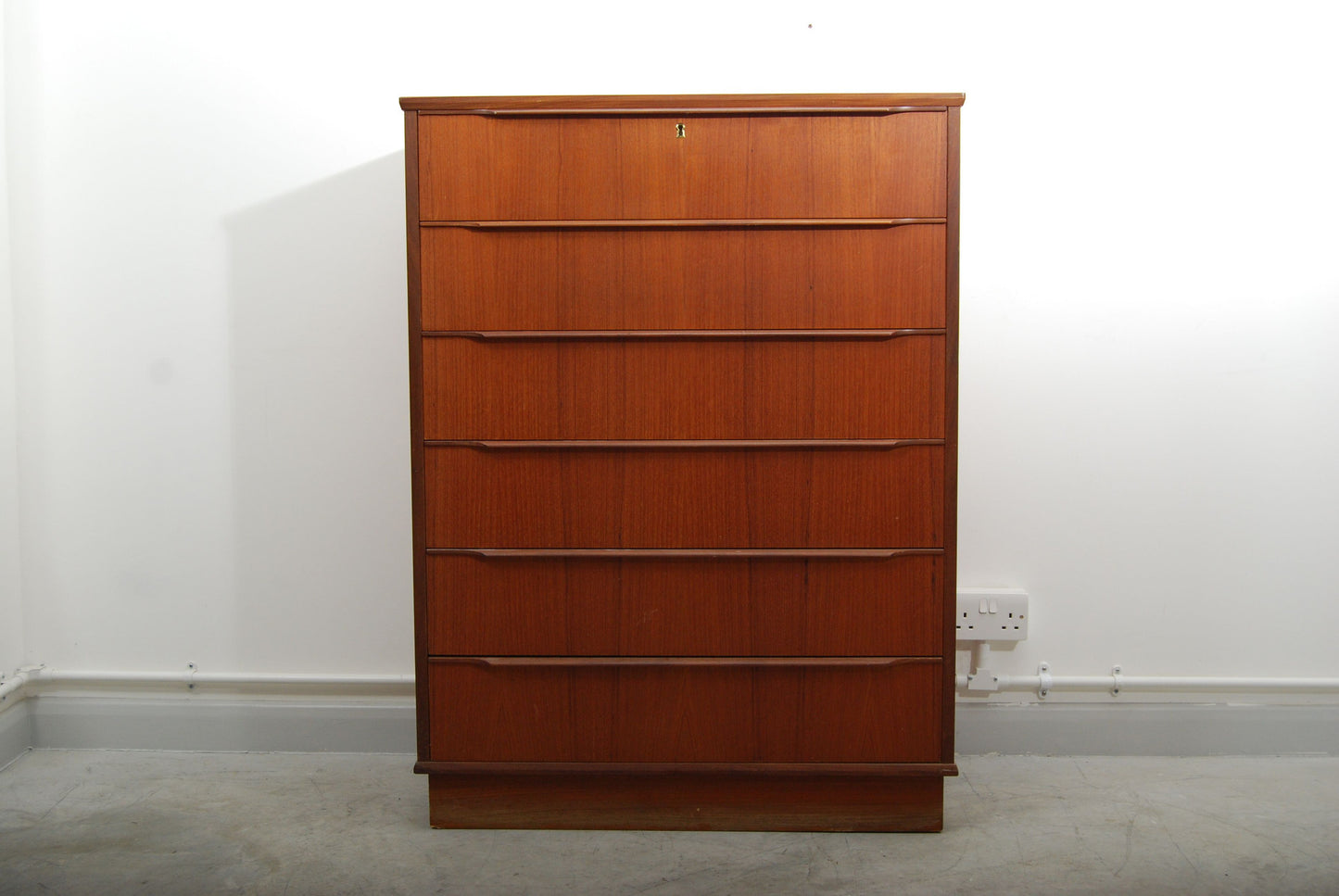 Tall teak chest of six drawers