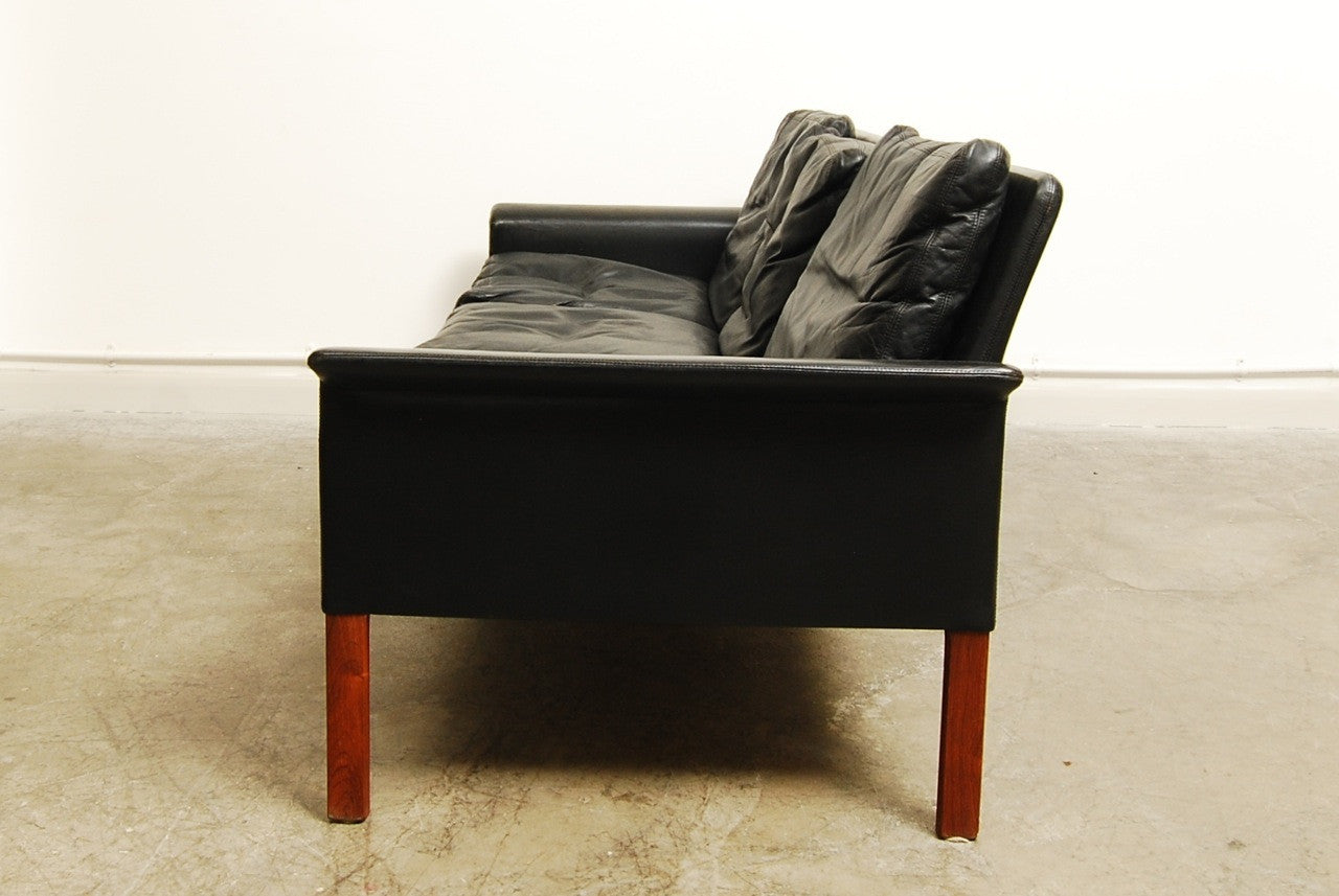 Three seat leather sofa by Hans Olsen