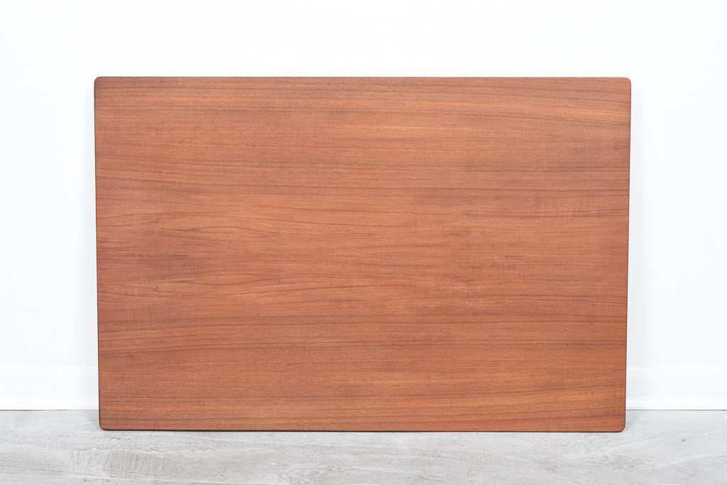 Extending teak dining table