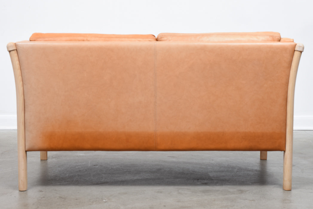 Two seat leather sofa by Stouby