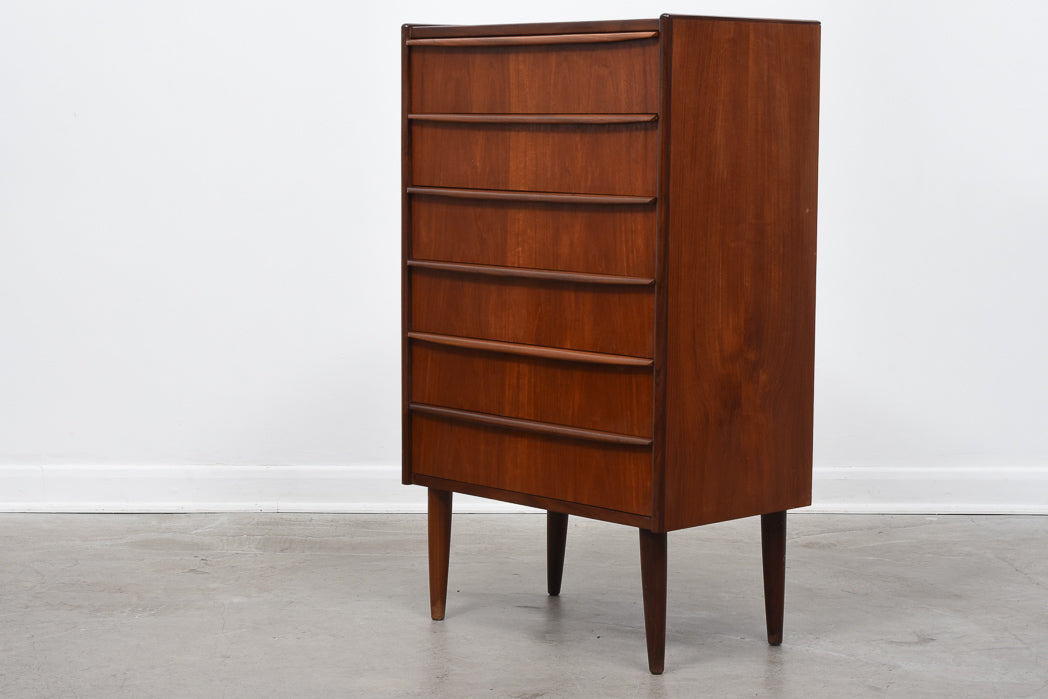 Chest of six drawers with lipped handles