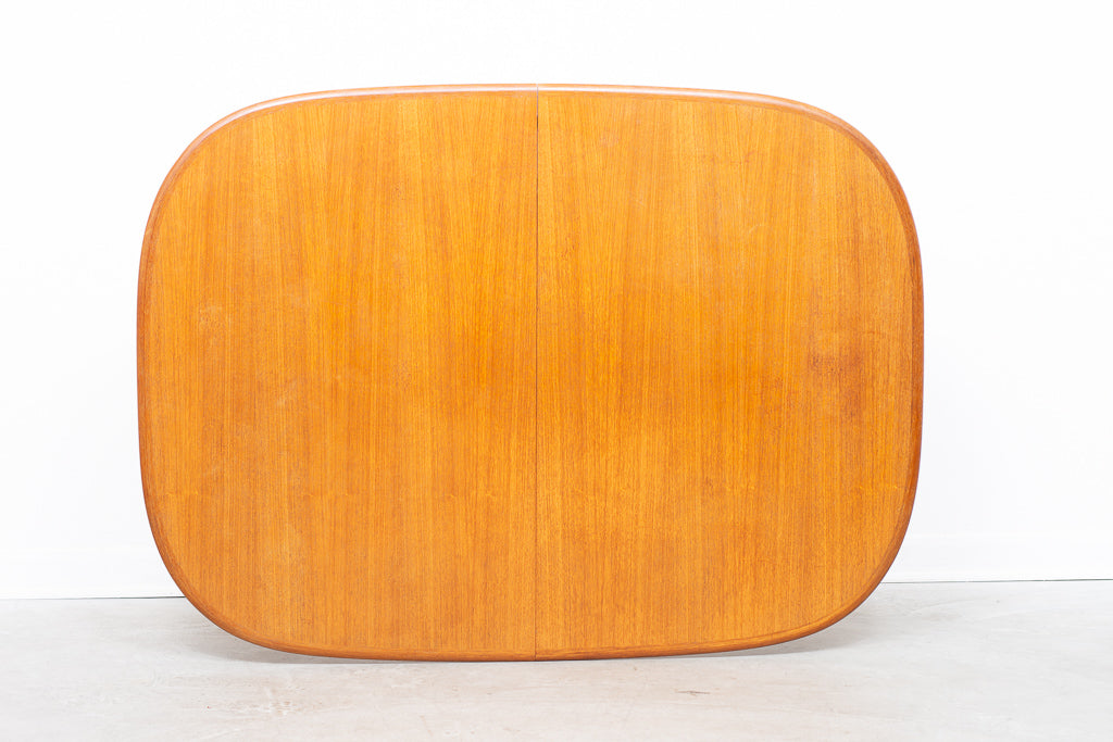 Extending oval dining table in teak