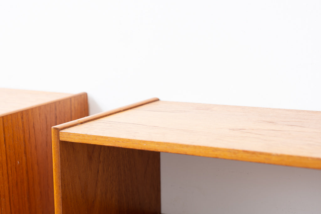 Wall-mounted bedside tables in teak