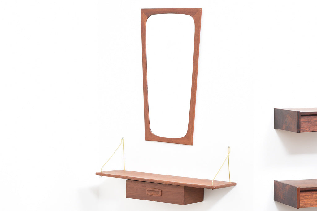 Floating shelf in teak with brass supports