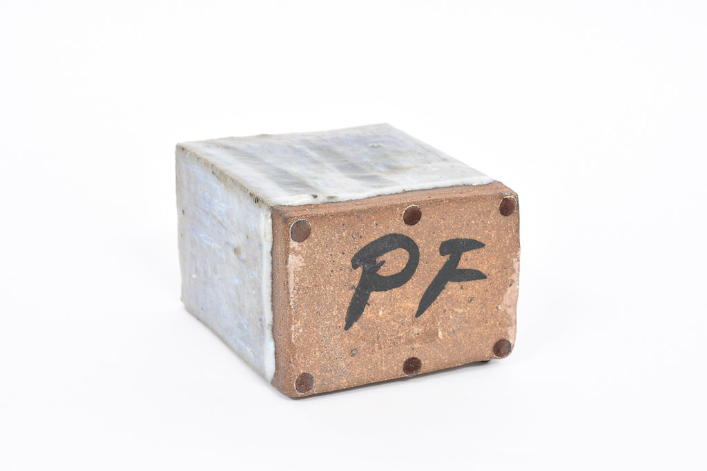 Rectangular stoneware vase with running glaze