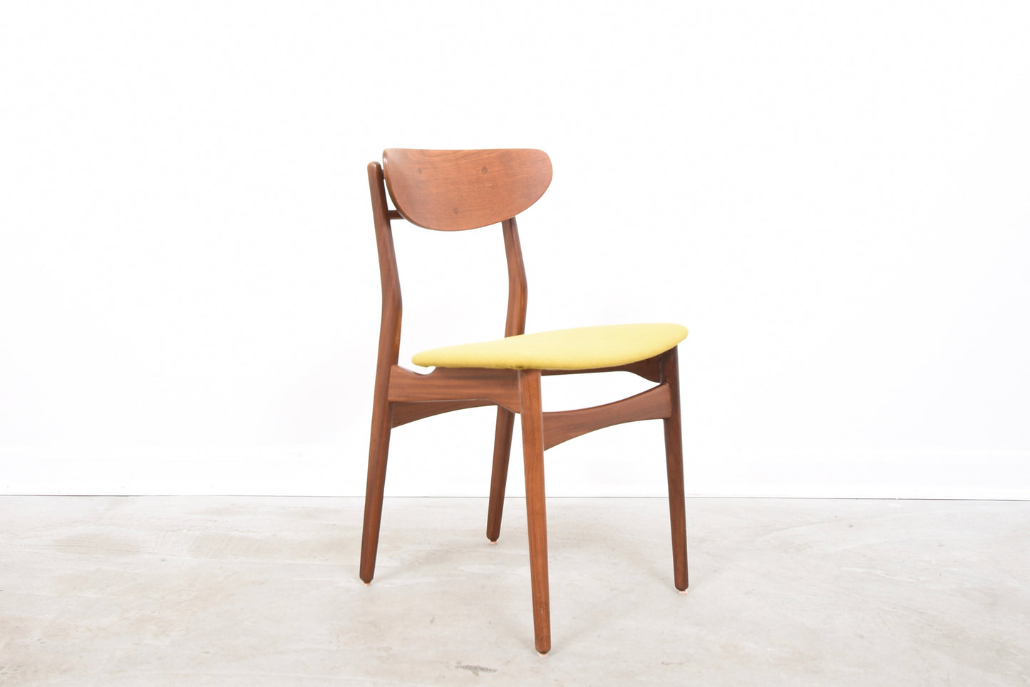 Set of four teak dining chairs