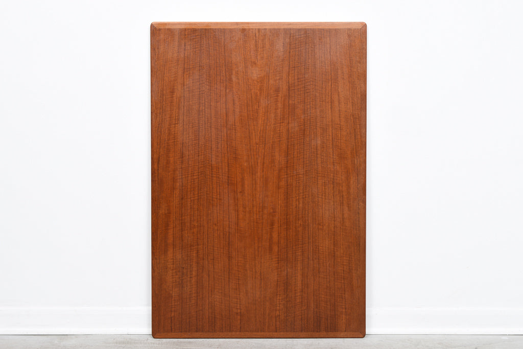 Extending dining table in teak