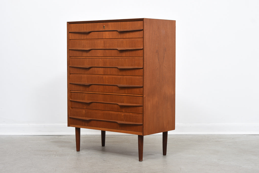 Teak chest of drawers with sculpted handles