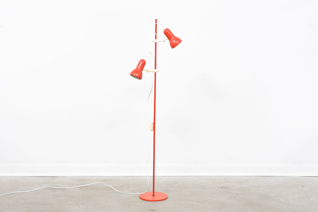 Red twin-headed floor lamp