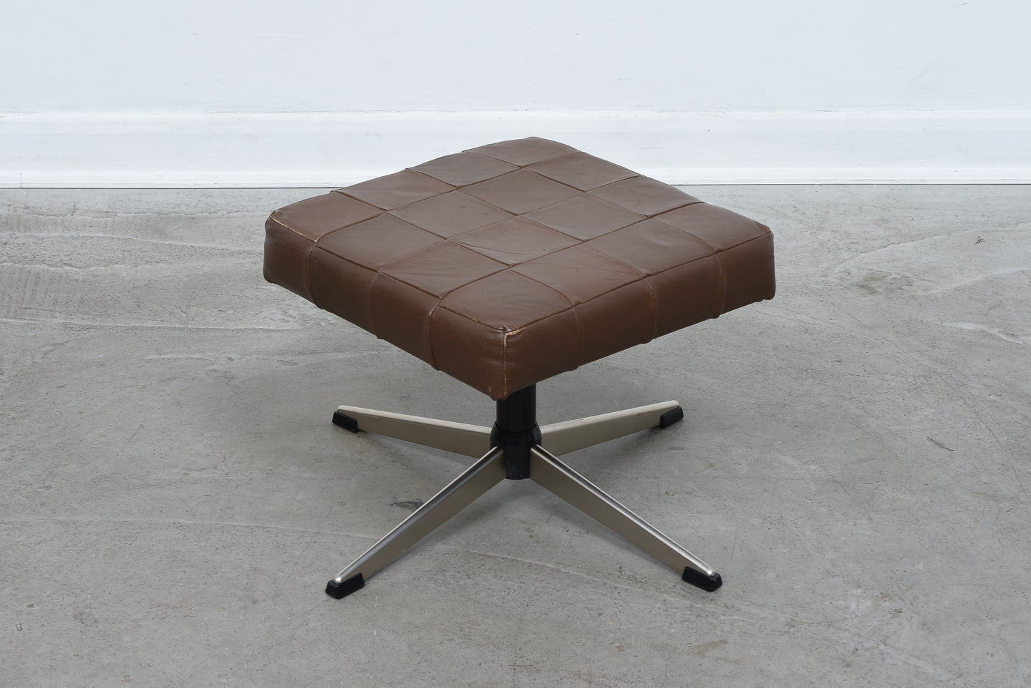 Vintage leather foot stool on metal base no. 2