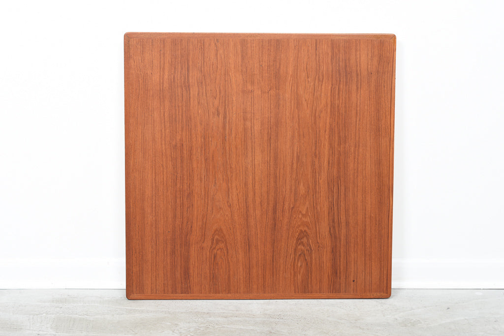 Square extending dining table in teak