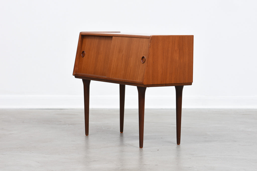 Low teak cabinet on turned legs