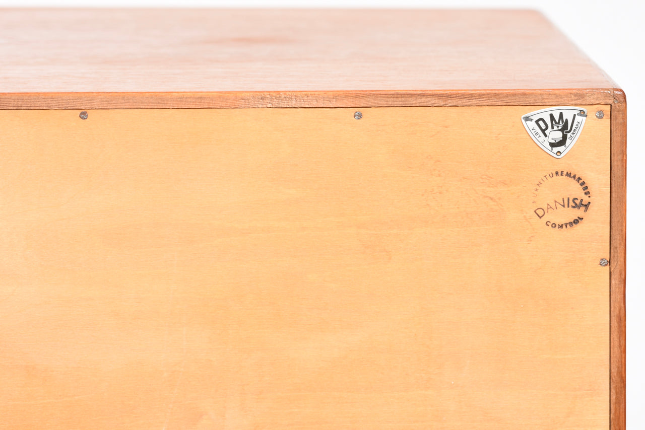 Bow-fronted chest of seven teak drawers