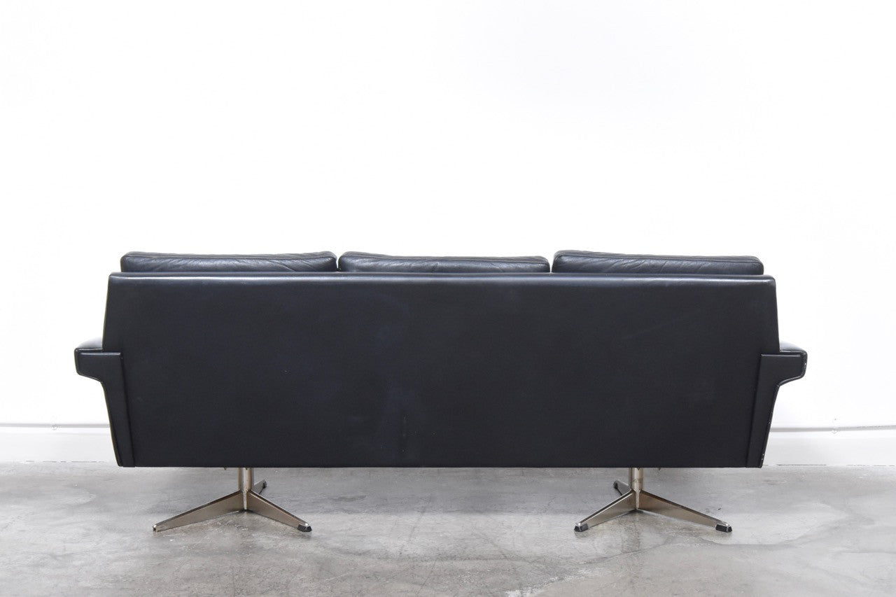 Black leather three seat sofa