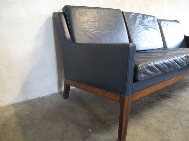 Dark blue leather three seater