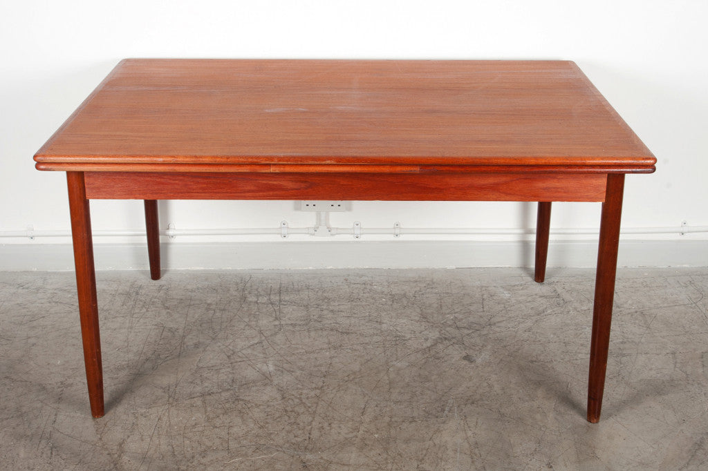Extending teak dining table
