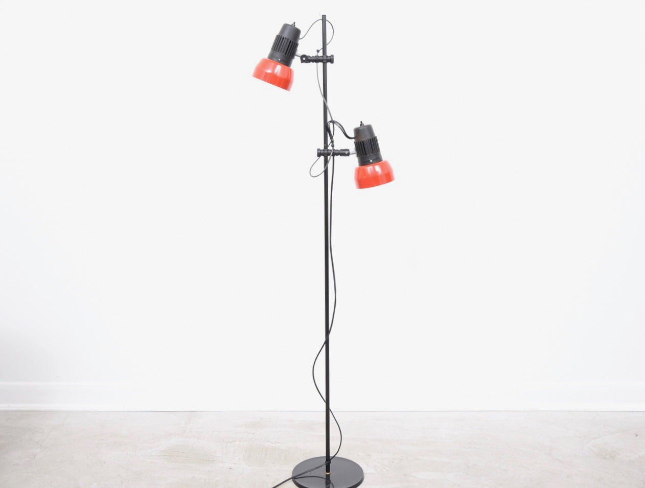 Twin-headed vintage floor lamp with red shades