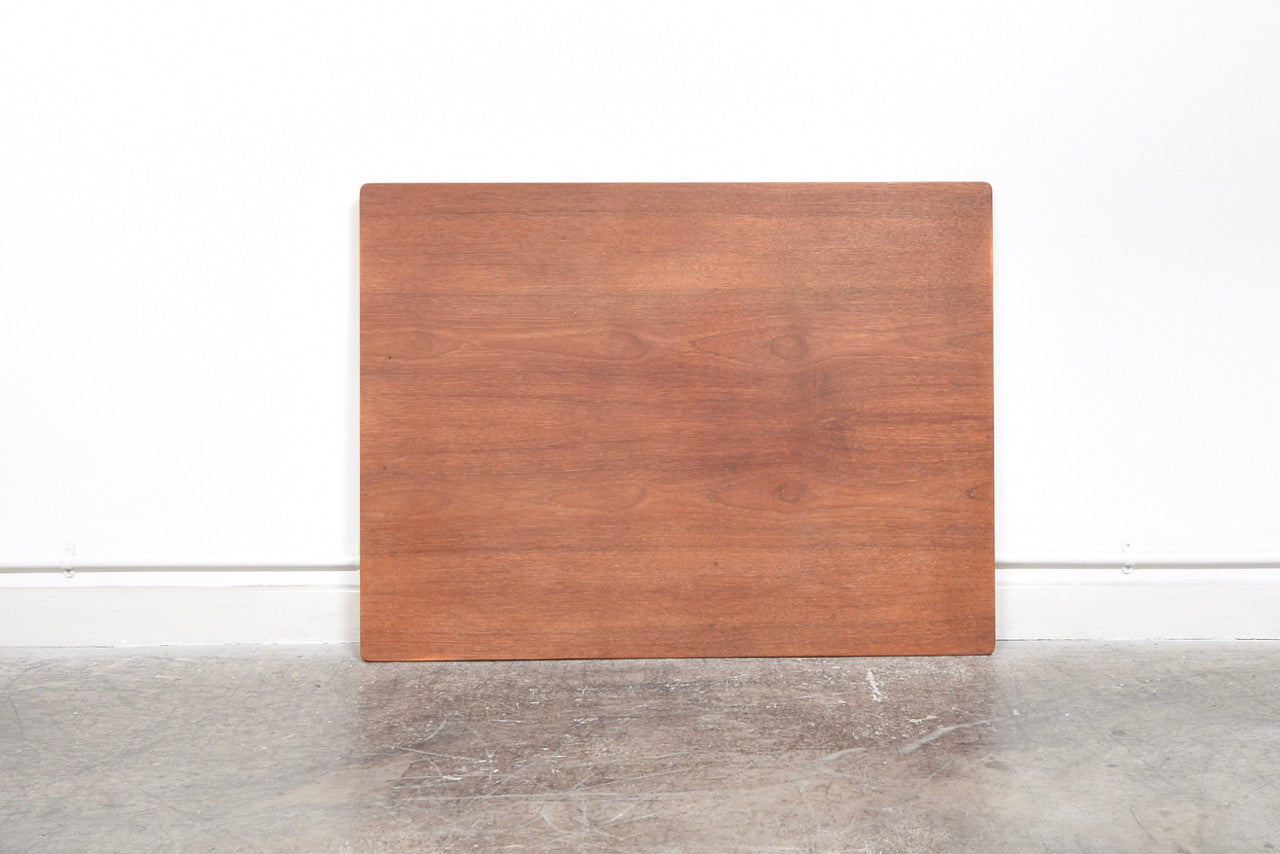 Extending rectangular dining table in teak