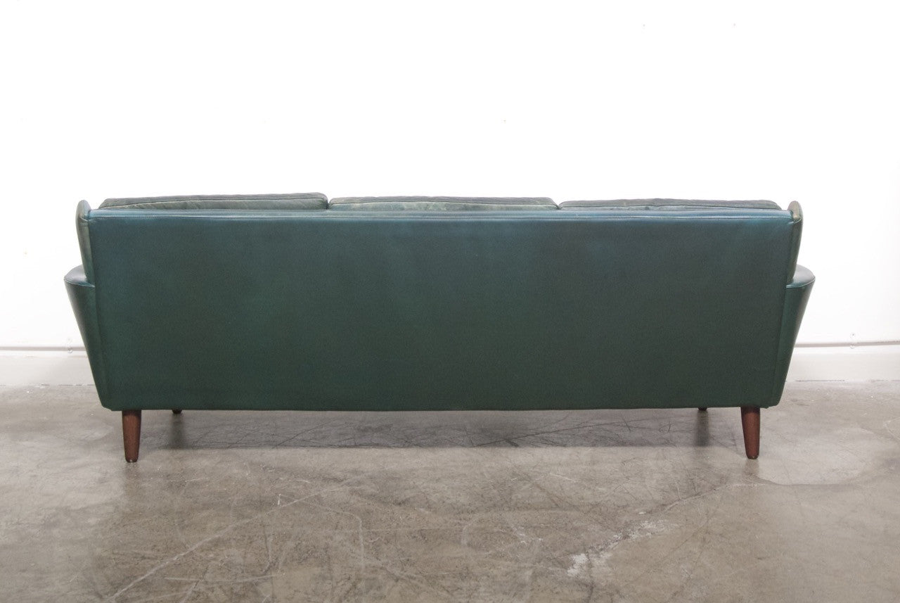 Dark green leather sofa