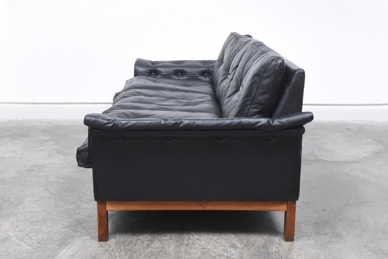 Black leather three seat sofa
