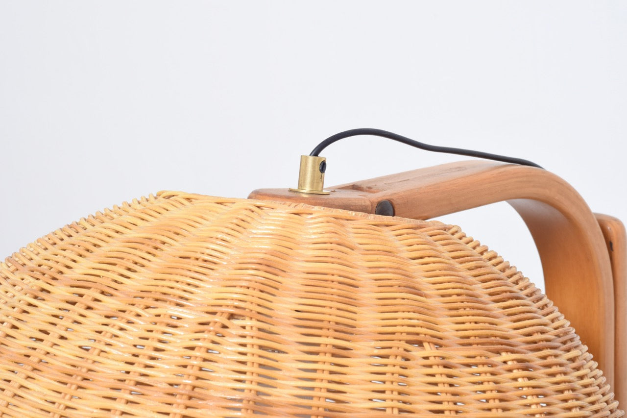 Floor lamp with wicker shade by Ateljé Lyktan