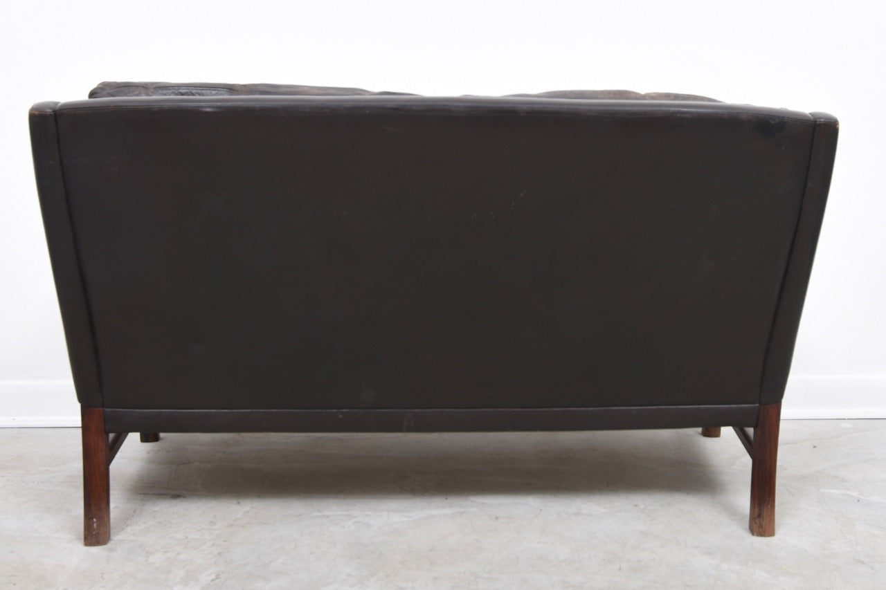 1960s two seat leather sofa on rosewood legs