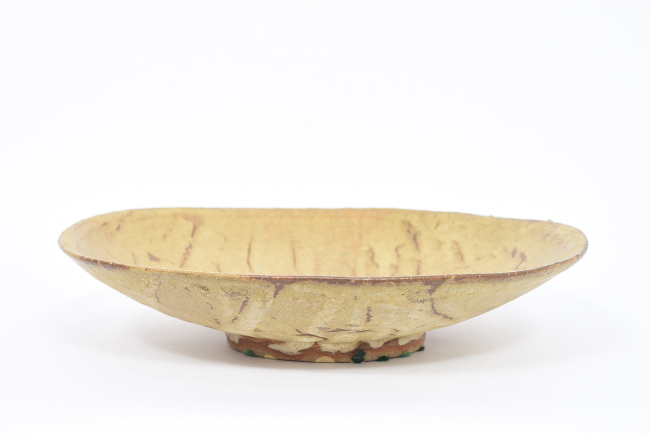 Large ceramic charger signed 'HM'