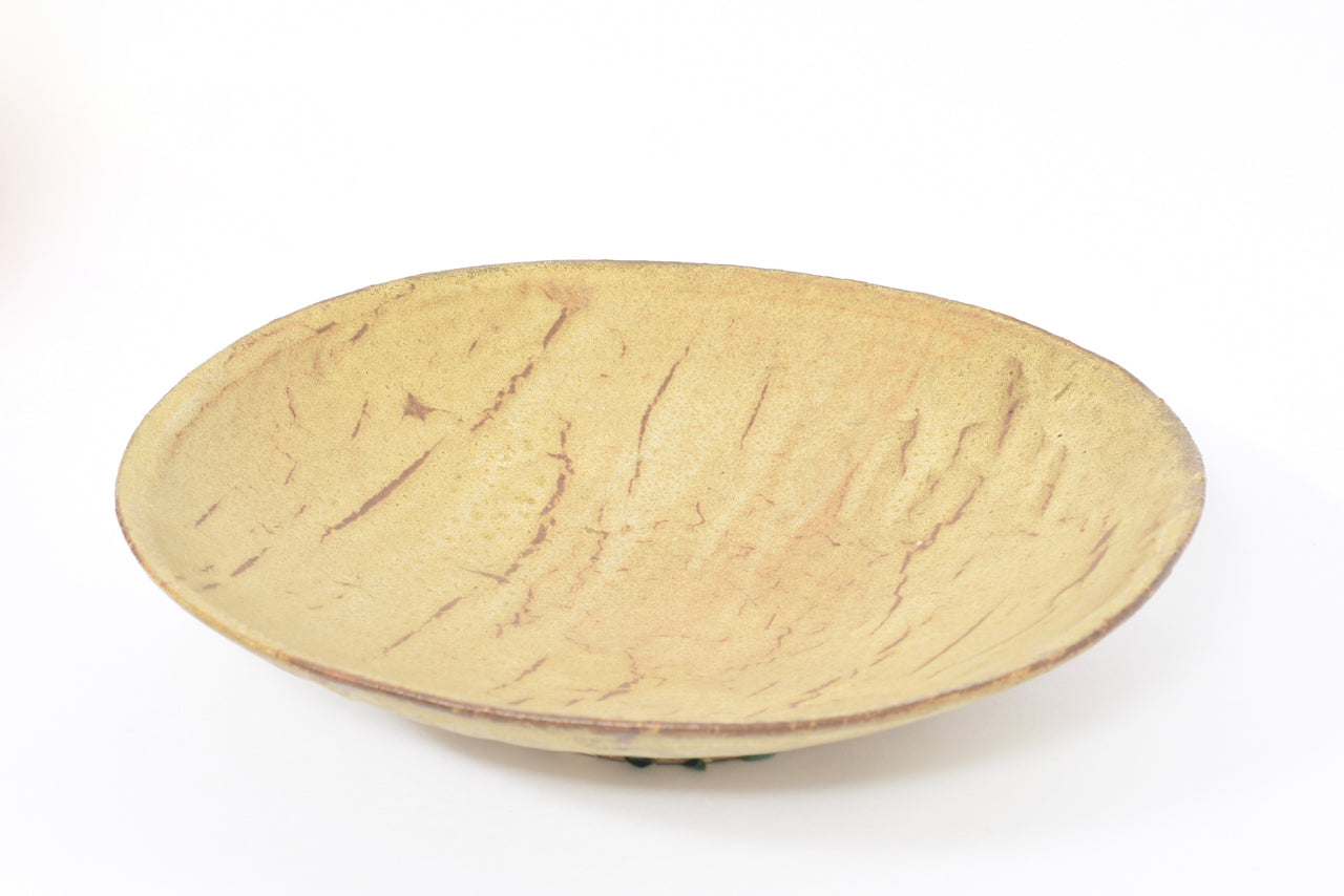 Large ceramic charger signed 'HM'