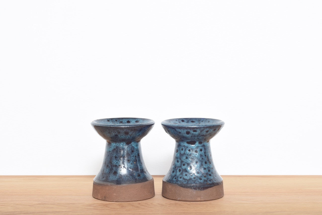 Pair of stoneware candle holders with blue glaze